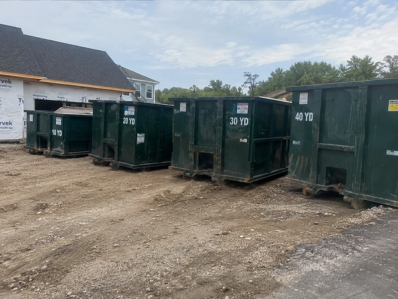 Different dumpster rental sizes lined up side by side